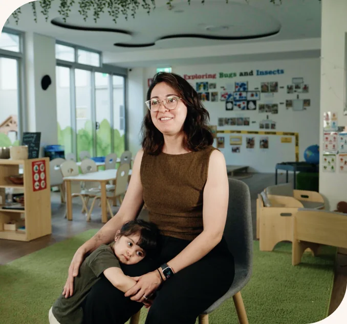 A parent and educator talking together at the centre