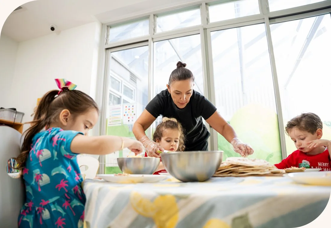 A family preparing food together at the centre