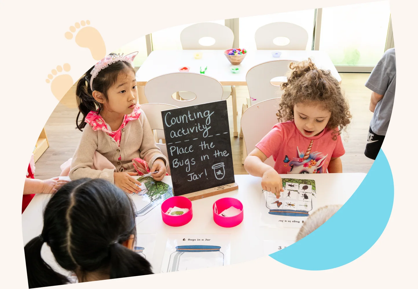 Children exploring a counting activity at Nurtured Education & Care