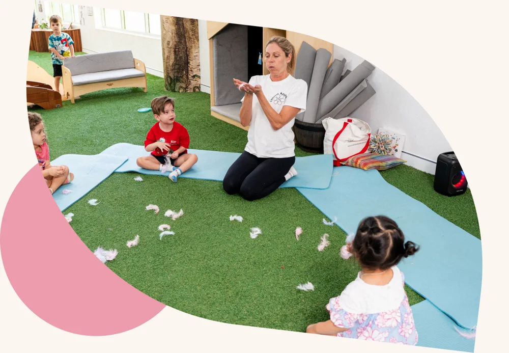 Educator guiding children during play-based learning